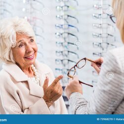 Outstanding Friendly Customer Service At The Optician Stock Photo Image Of Shop Assistant Showing Old Lady