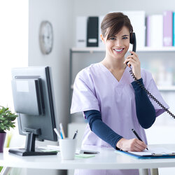 Must Have Phone Tips For Medical Receptionists Receptionist Smiling At The Cl