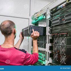 Wonderful Technical Support Engineer Performs The Installation Of New Server In Rack Computer Equipment Man
