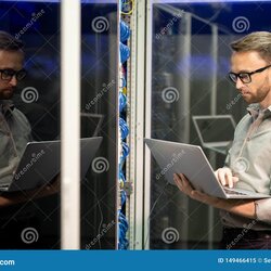 Out Of This World It Engineer Providing Network Support Stock Image Cabinet Serious Preview Busy Young Beard