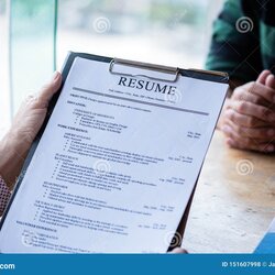 Terrific Interviewer Reading Resume Person Submits Job Application Describe Yourself To Close Up View